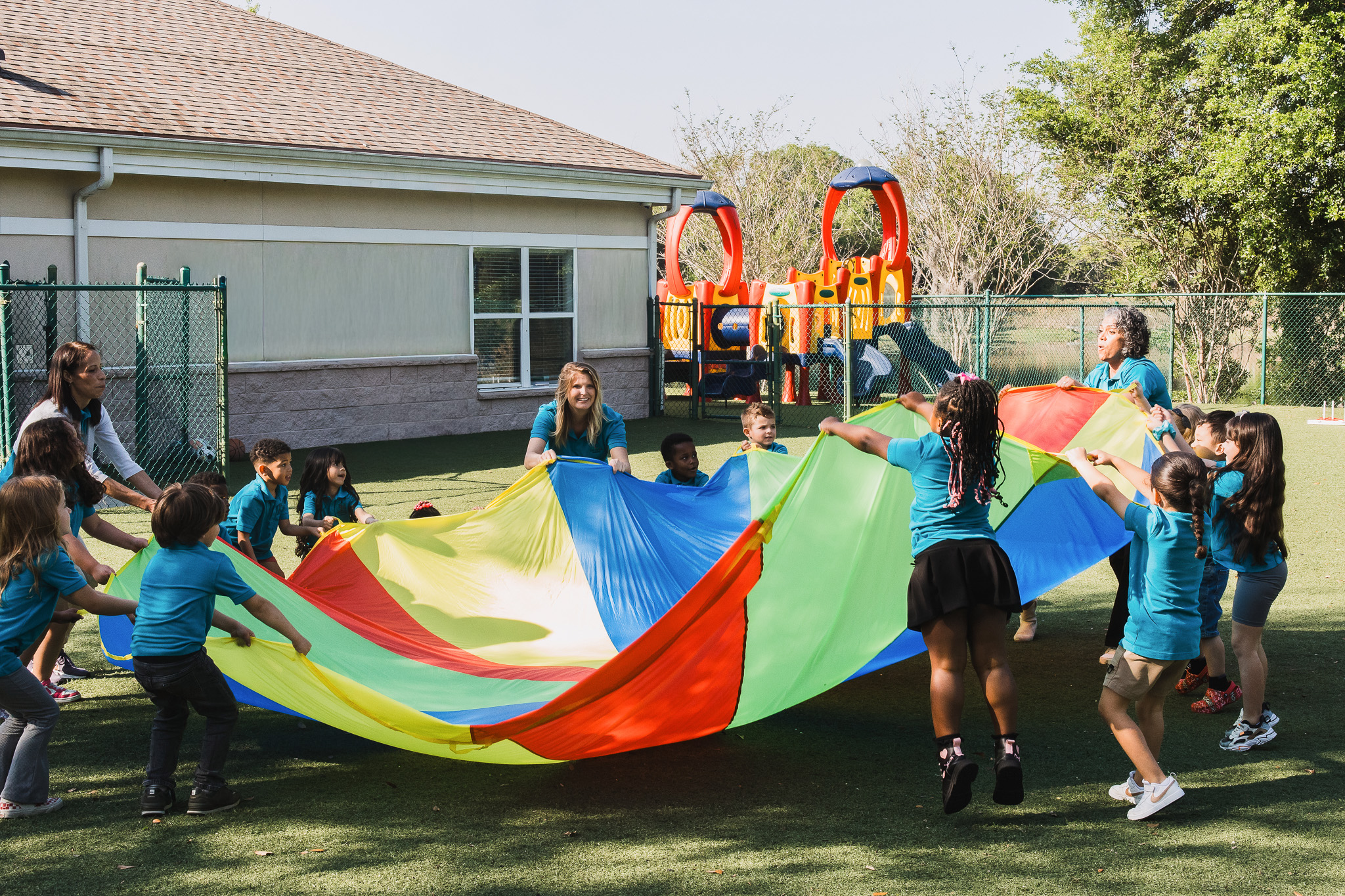 Outdoor parachute play at Little Newtons Academy