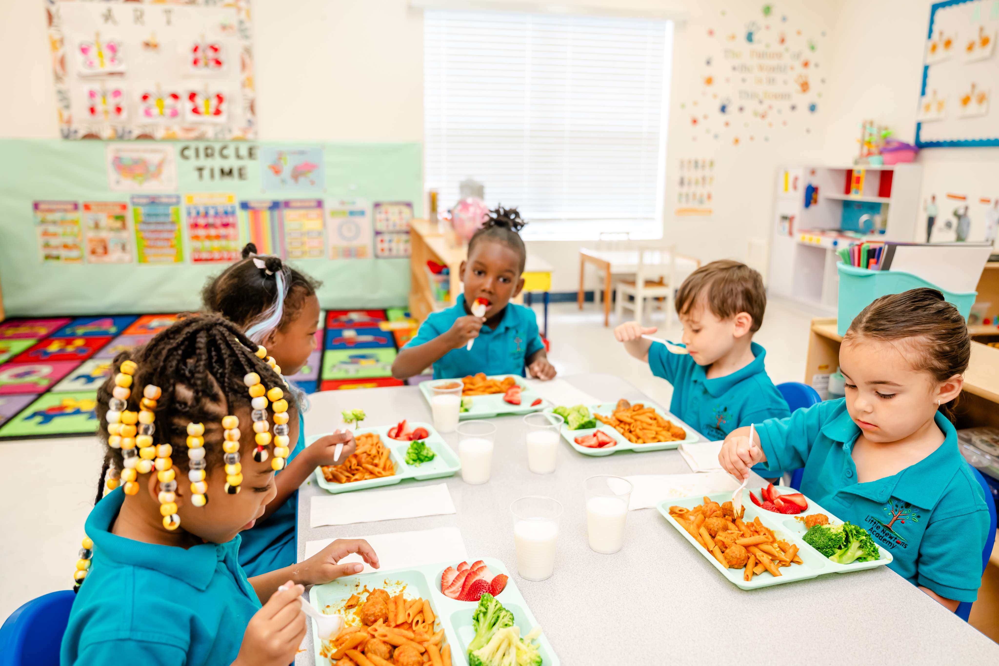 Children enjoying a healthy lunch together at the table