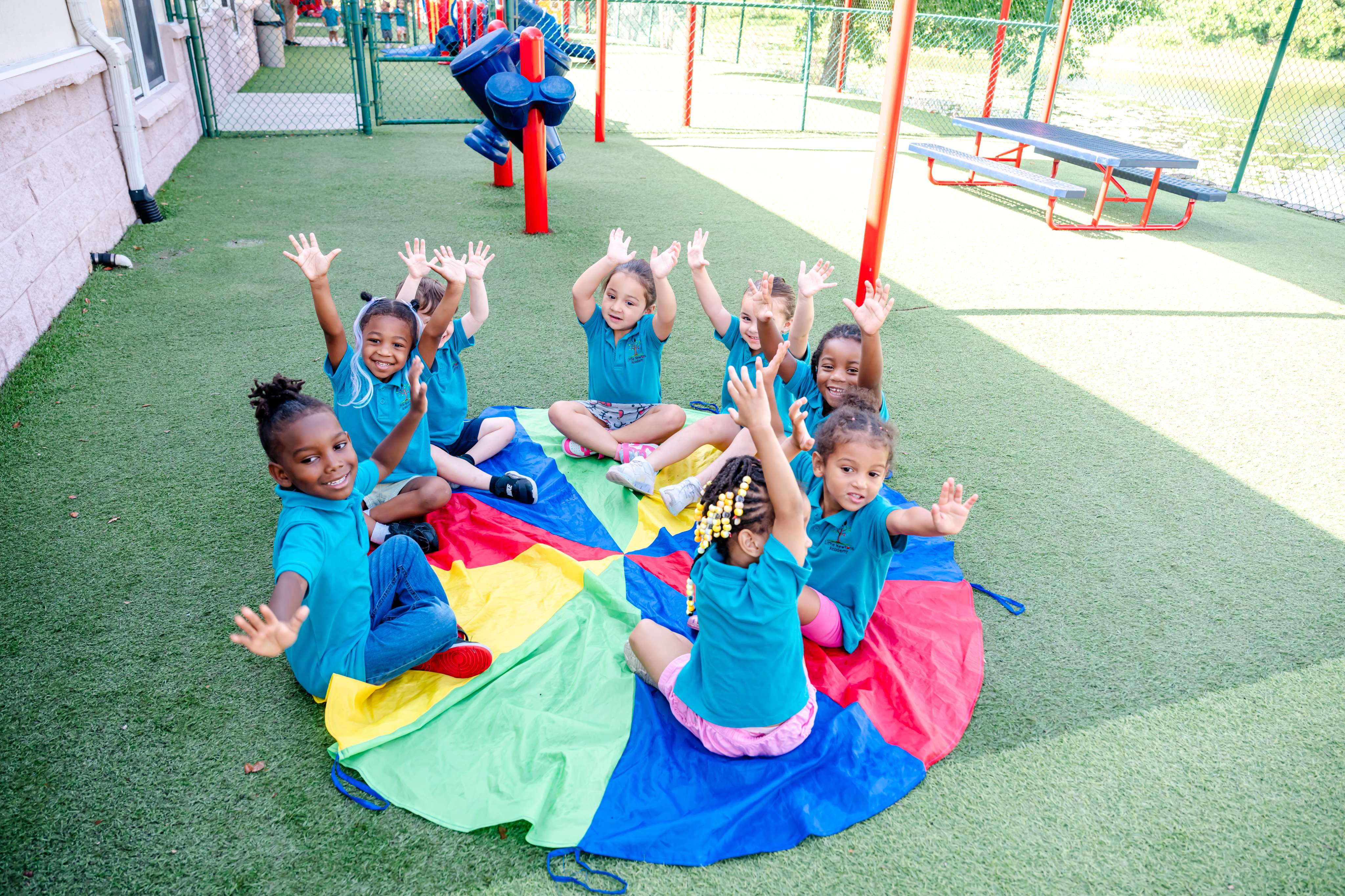 Children playing a group parachute game outdoors